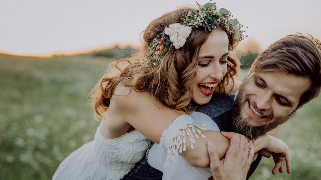 newly married couple who chose a smaller wedding venue over a much larger, more popular wedding venue