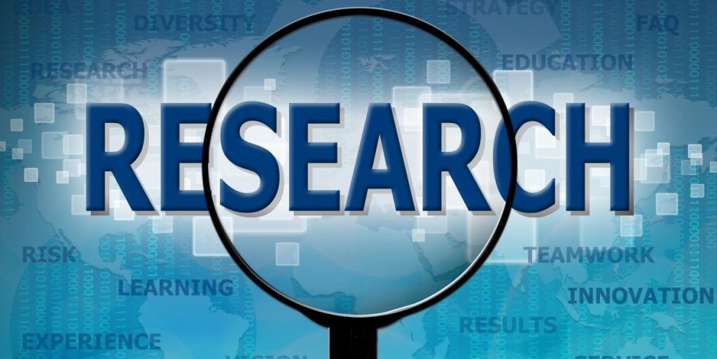 magnifying glass over the word research